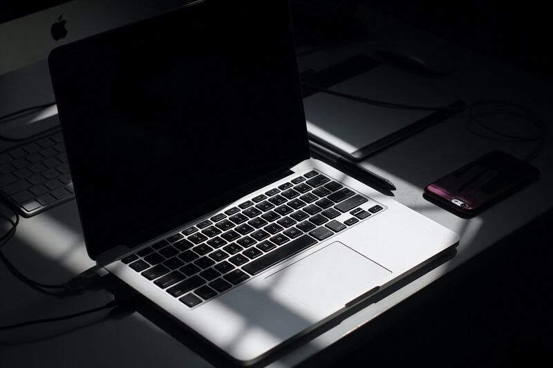 laptop in the shadow; the concept of cybersecurity training