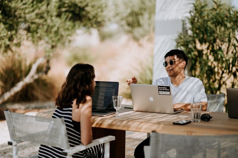 two people discussing business details