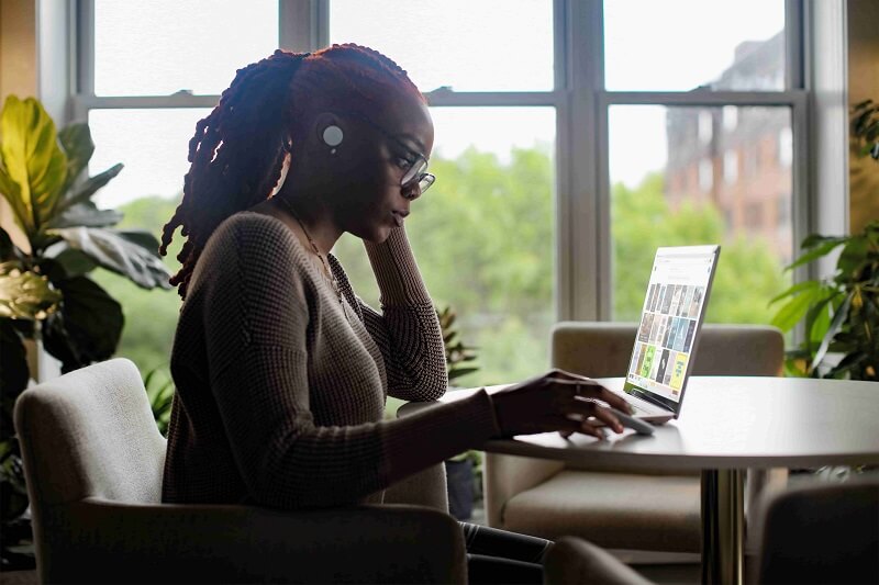 a woman browsing the internet, trying to remember passwords