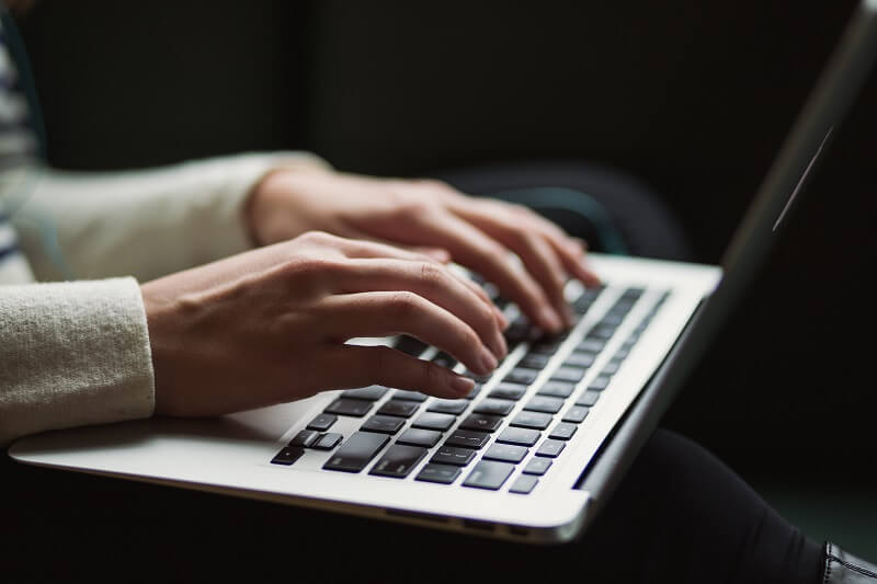 alternative to Sticky Password, an image of a person typing a laptop