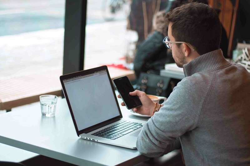 the man working in a busy cafe, the concept of having too many passwords